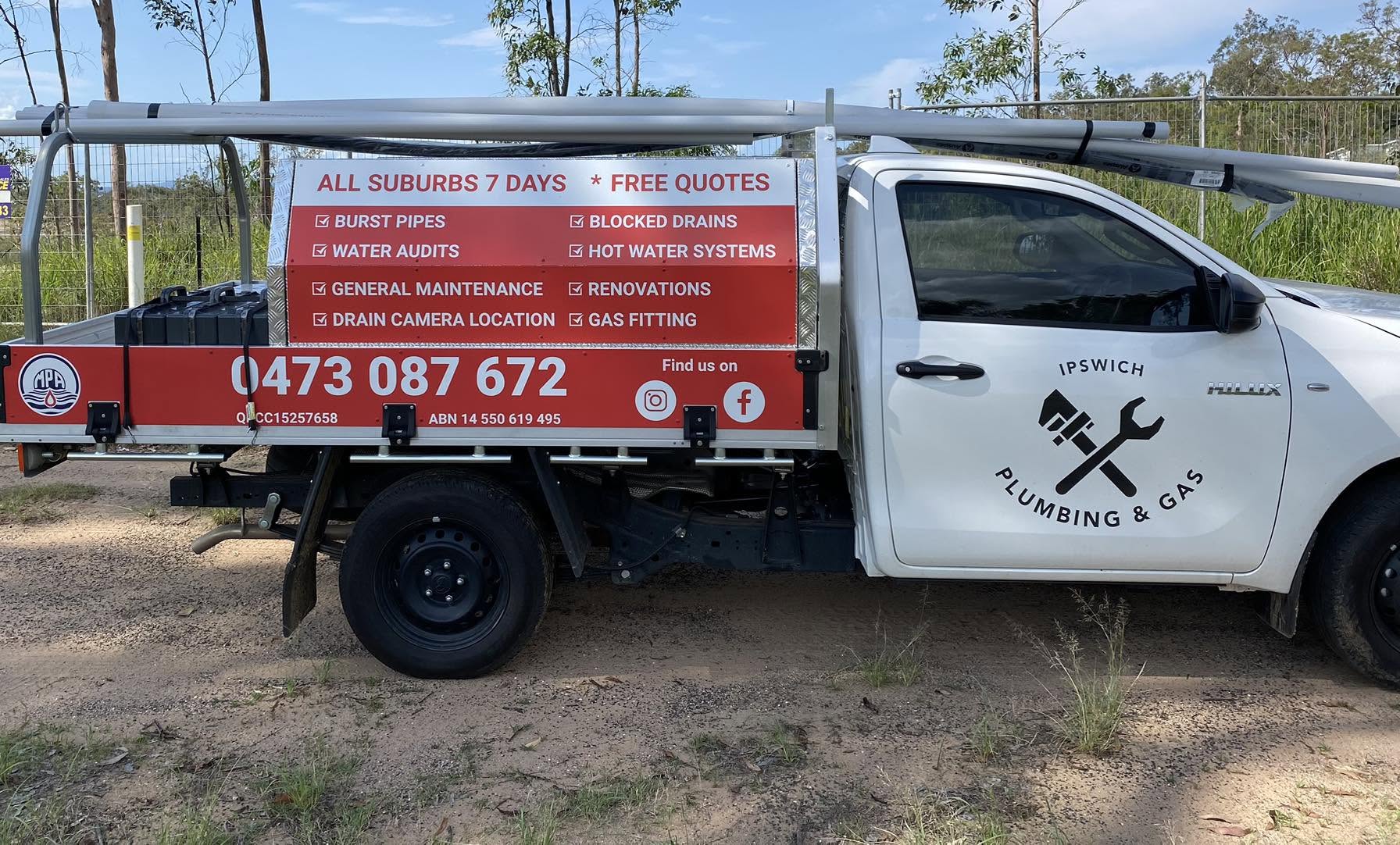 Ipswich Plumbing and Gas work ute with red, white and black vehicle signage